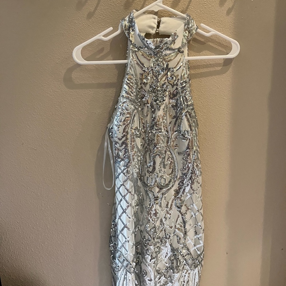 Super cute mini sparkly dress for a size 5-6! Low cut in the back.